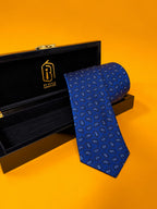 Blue Prestige royal blue paisley necktie resting in an open black gift box