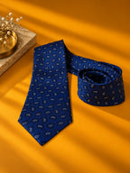 Close view of the Blue Prestige royal blue paisley tie, rolled, with white paisley detail