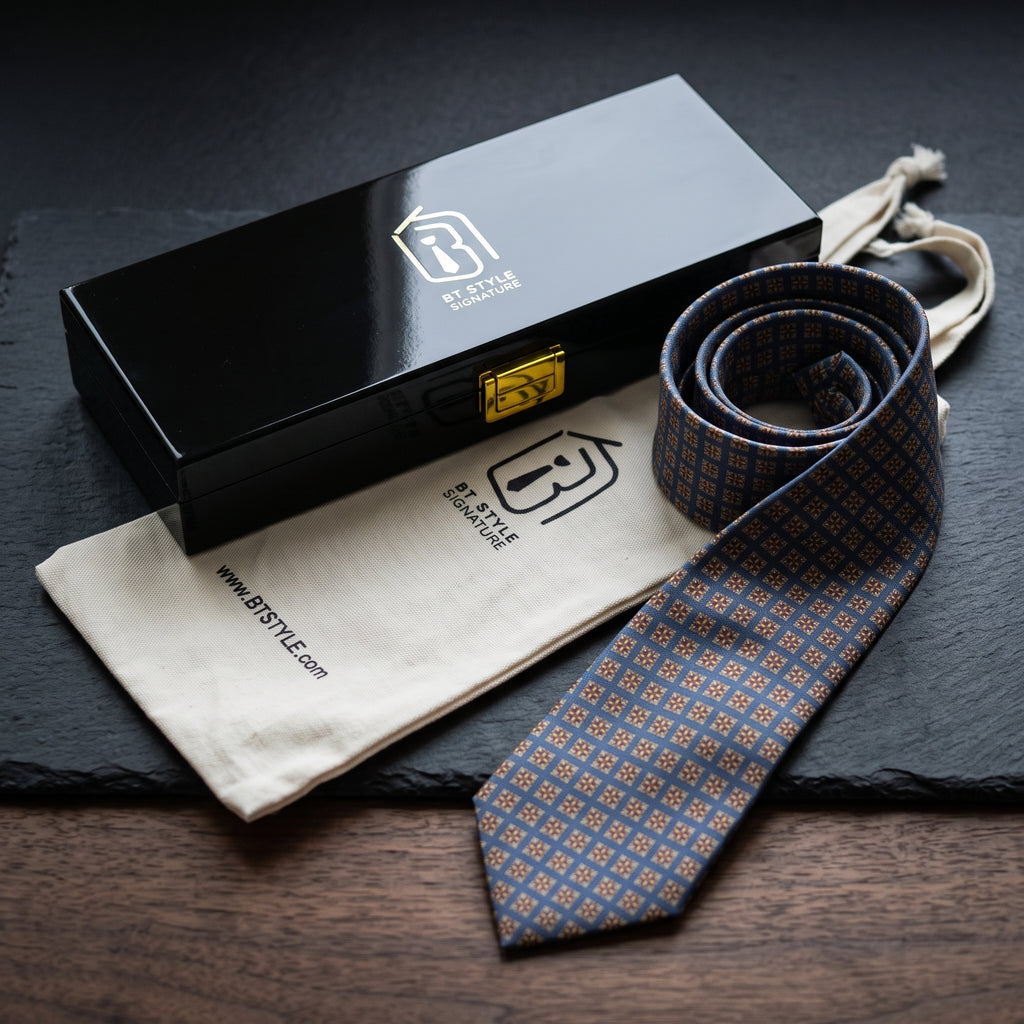 Windsor necktie rolled beside the black BT Style Signature gift box