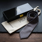Windsor necktie rolled beside the black BT Style Signature gift box