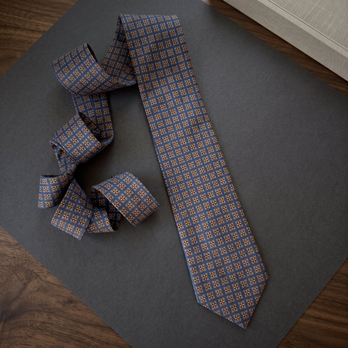 Windsor slate-blue necktie on a dark surface